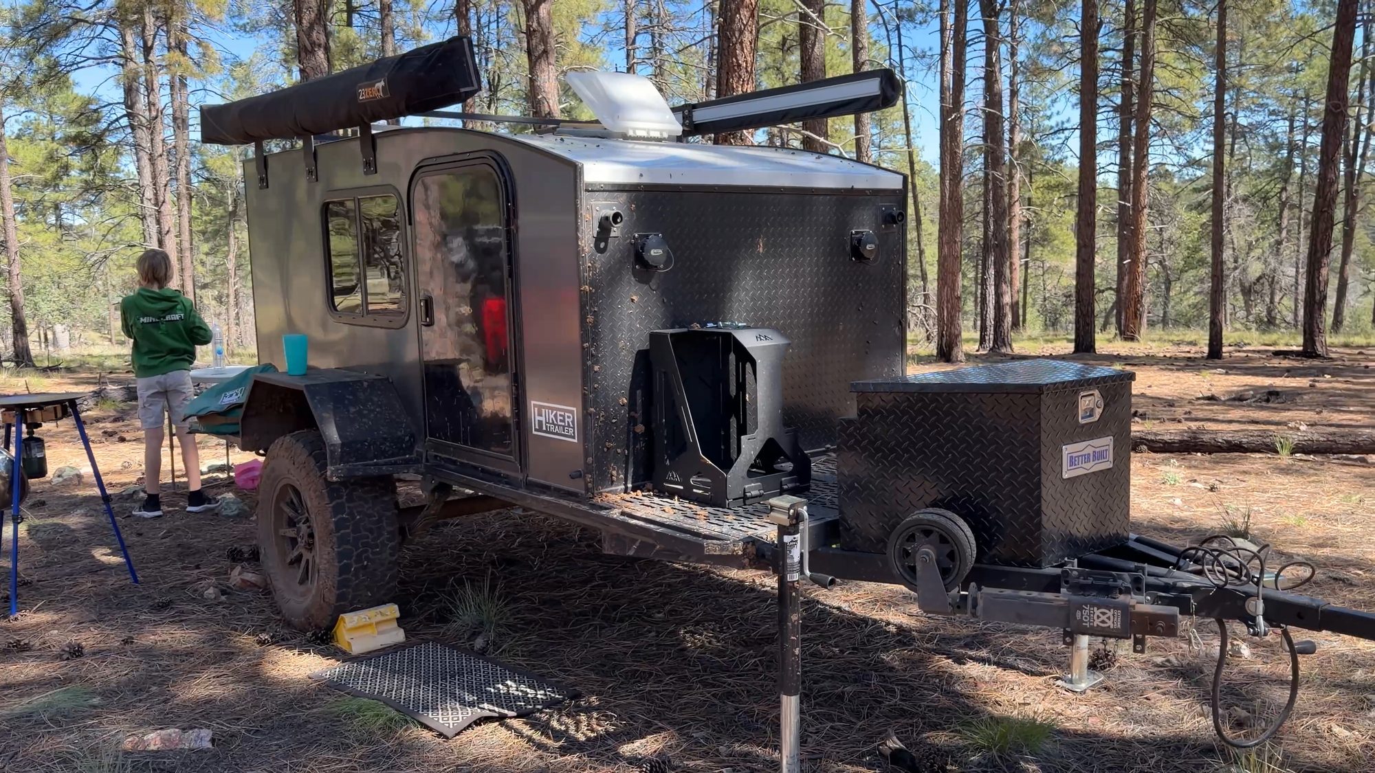 Donovan’s Hiker trailer at camp in the pines