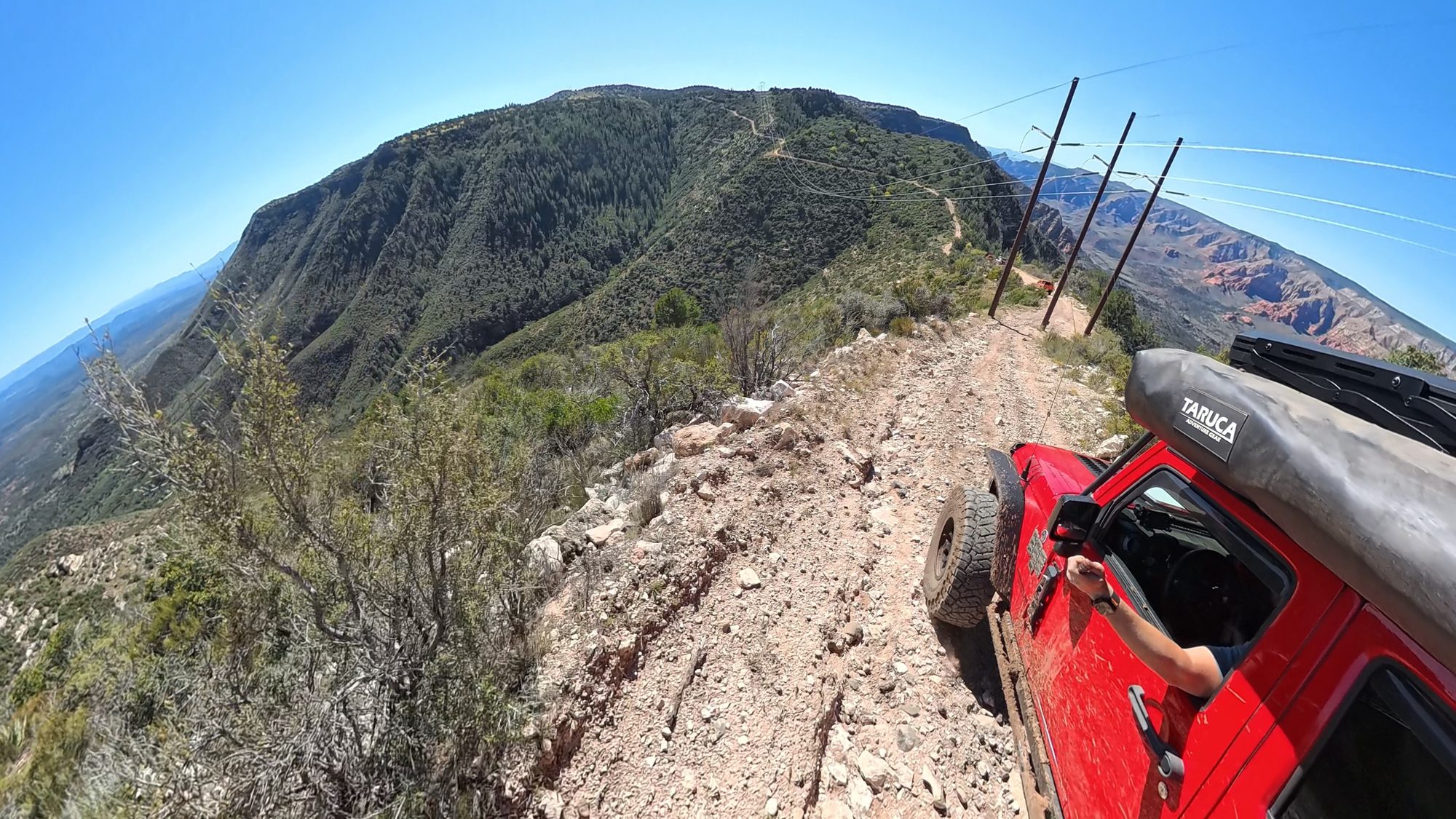 Ridge road following power lines between two wilderness areas