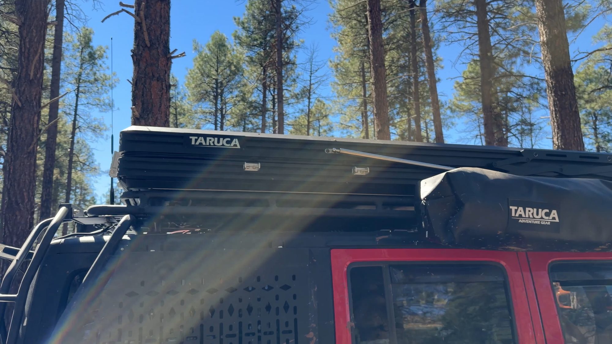 Taruca rooftop tent closed and latched on a Jeep roof rack