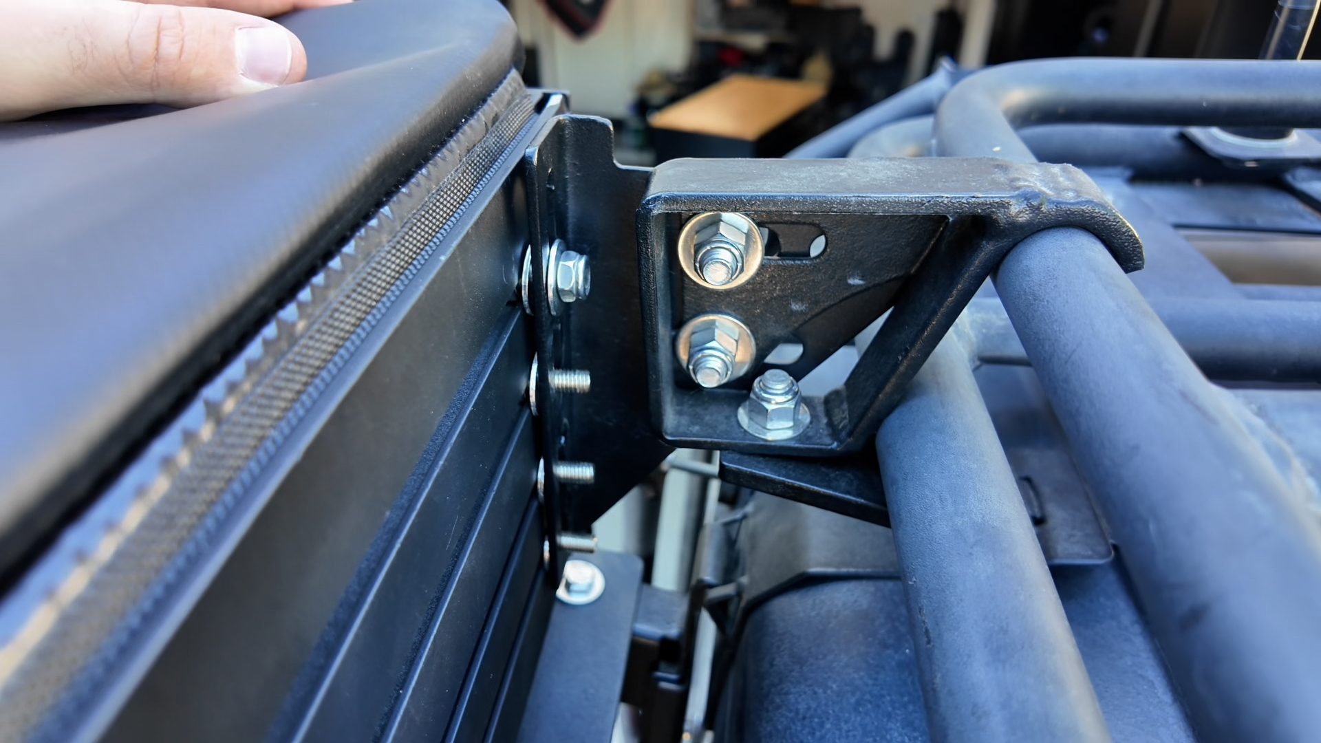 Close-up of washers between the ensuite backing plate and a Gobi awning bracket